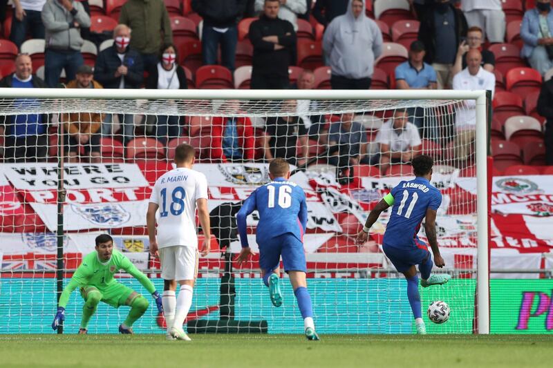 England's Marcus Rashford scores his side's first goal from the penalty spot. AP