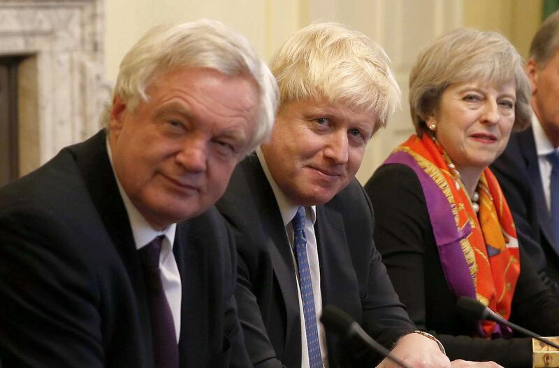 (FILES) In this file photo taken on November 28, 2016, British Prime Minister Theresa May (R) sits with members of her cabinet British Secretary of State for Exiting the European Union (Brexit Minister) David Davis (L) and British Foreign Secretary Boris Johnson in the Cabinet Room inside 10 Downing Street in central London. British Foreign Secretary Boris Johnson has resigned, Downing Street said in a statement on July 9, 2018, hours after Brexit minister David Davis stepped down. / AFP / POOL / PETER NICHOLLS

