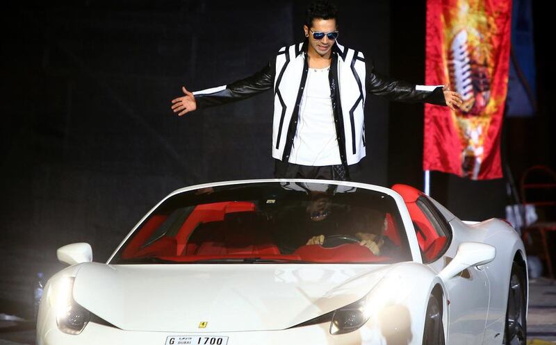 Indian actor and dancer, Varun Dhawan arrives in a Ferrari luxury car. AFP