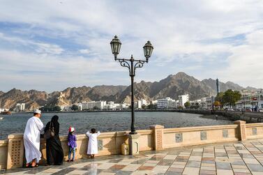 An Omani family stands by the waterfront in the Mutrah area of the capital Muscat on November 16, 2018. (Photo by GIUSEPPE CACACE / AFP)