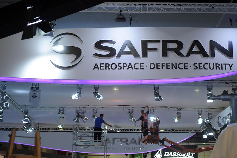 Employees set up Safran signs at the Paris International Air Show -- June 14, 2013 -- . (Antoine Antoine for The National) *** Local Caption ***  Paris Air Show023.JPG