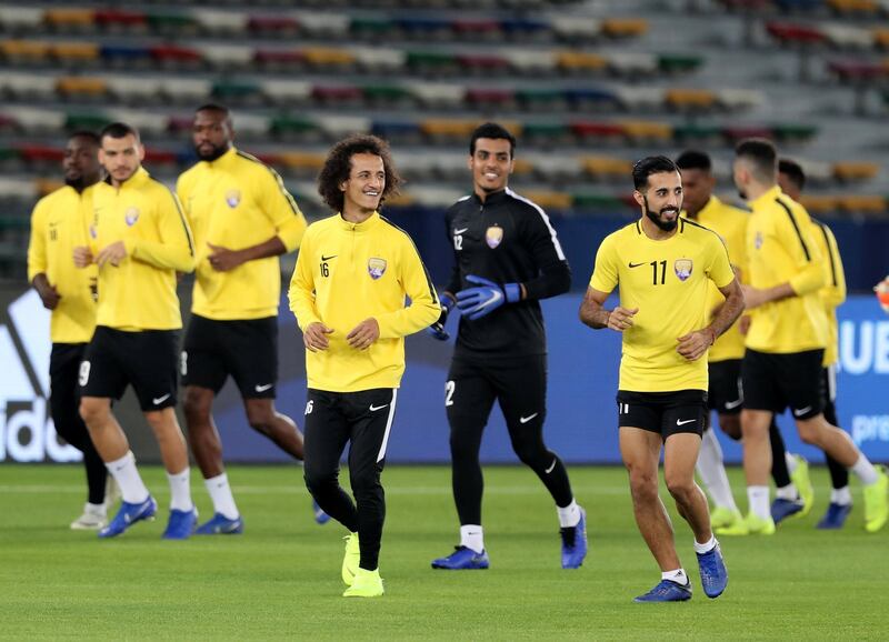 Abu Dhabi, United Arab Emirates - December 21, 2018: Mohamed Abdulrahman (16) and Bandar Alahbabi (11) of Al Ain train ahead of the Fifa Club World Cup final. Friday the 21st of December 2018 at the Zayed Sports City Stadium, Abu Dhabi. Chris Whiteoak / The National