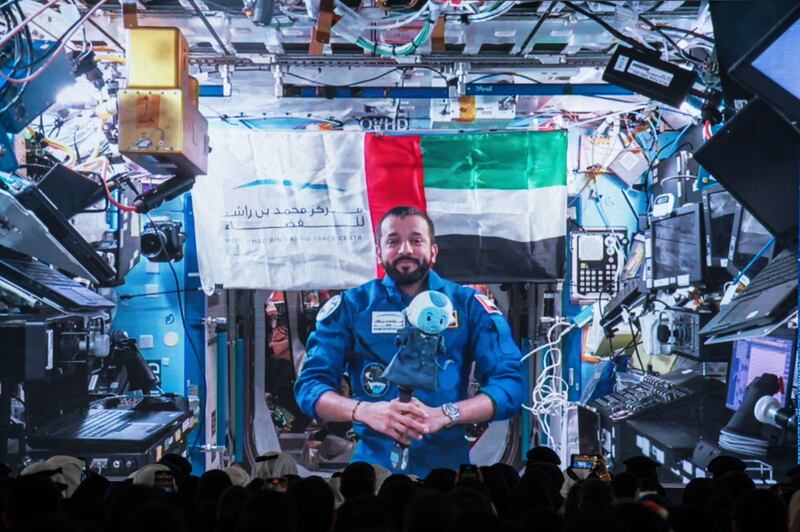 Emirati astronaut Sultan Al Neyadi speaks to students at UAE University in Al Ain on a live call from the International Space Station on May 23. Ryan Lim/The National