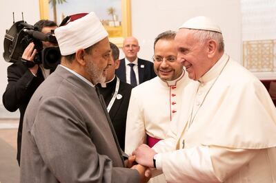 Pope Francis, Head of the Catholic Church shakes hands with Sheikh Ahmed Mohamed el-Tayeb, Egyptian Imam of al-Azhar Mosque, upon his arrival at Abu Dhabi International airport in Abu Dhabi, United Arab Emirates, February 3, 2019. WAM/Handout via REUTERS ATTENTION EDITORS - THIS PICTURE WAS PROVIDED BY A THIRD PARTY