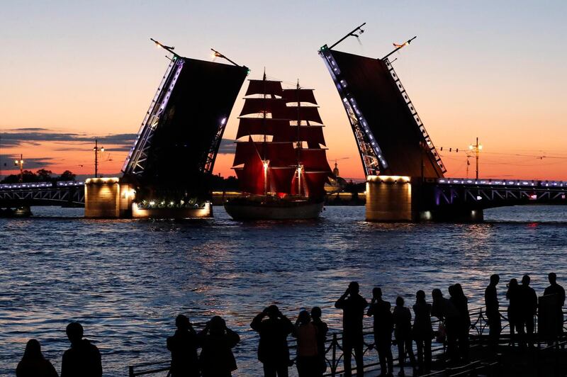 The frigate Rossiya floats on the Neva River past Dvortsovy bridge during a rehearsal for the festivities marking school graduation in St Petersburg, Russia.  EPA