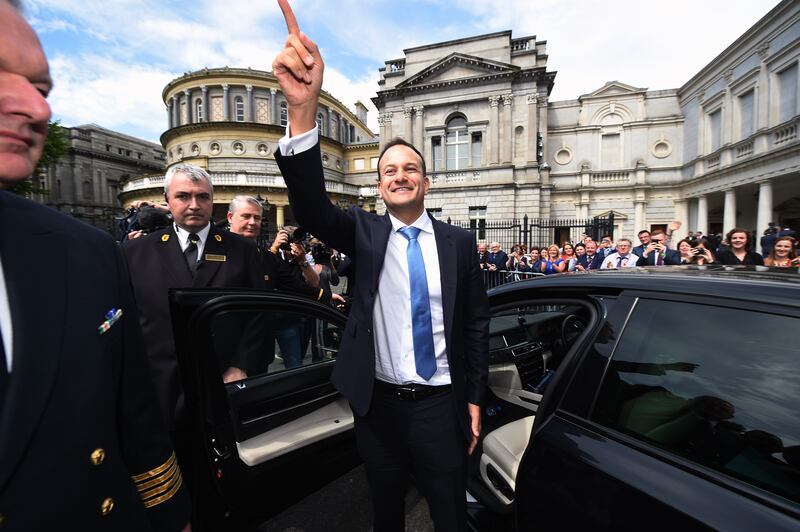 Mr Varadkar waves to the crowds at Leinster House, Dublin, after being elected Taoiseach in June 2017. Getty Images