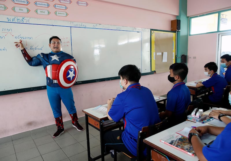 Thai teacher Sattawat Kongsang dressed in cosplay as Captain America teaches in a classroom at Prataungtipvittaya School in Bangkok, Thailand. EPA