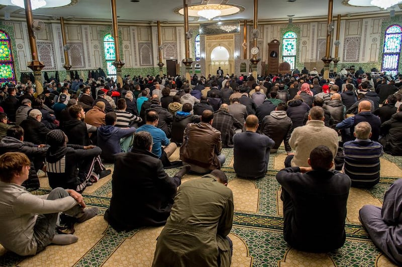 A Muslim cleric speaks ahead of Friday prayers at the Grand Mosque in Brussels. Photo: AFP PHOTO / PHILIPPE HUGUEN