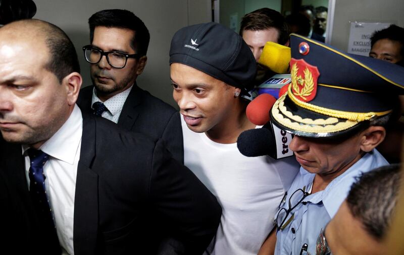 Ronaldinho leaves Paraguay's Supreme Court after testifying. Reuters