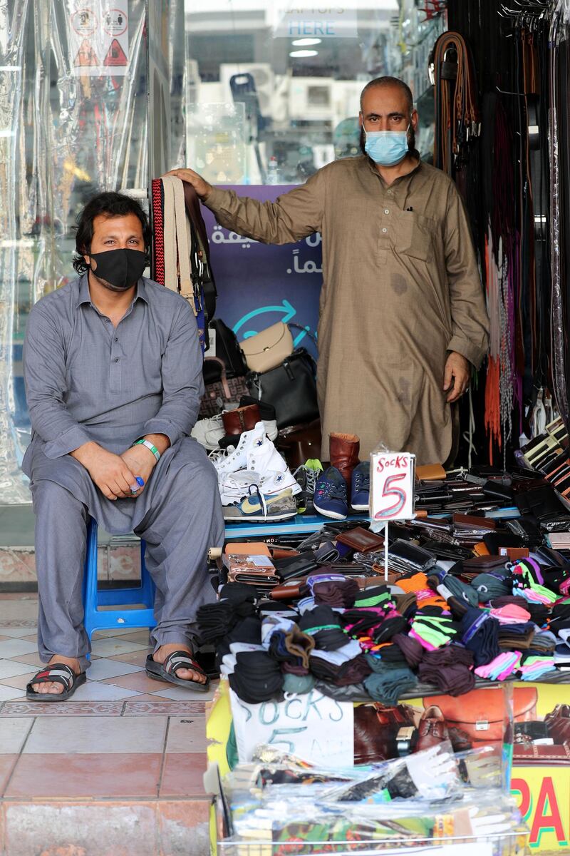 Dubai, United Arab Emirates - Reporter: N/A. News. Coronavirus/Covid-19. Two gentleman at their stall in Satwa, Dubai. Tuesday, October 20th, 2020. Dubai. Chris Whiteoak / The National