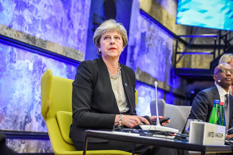 British Prime Minister Theresa May attends a session of the Tallinn Digital Summit during a European Union summit in Tallinn, Estonia, on September 29, 2017.
EU leaders hold a digital summit in the Estonian capital with French President Emmanuel Macron seeking to persuade his counterparts to overhaul European tax rules targeting Silicon Valley firms. / AFP PHOTO / Ilmars ZNOTINS