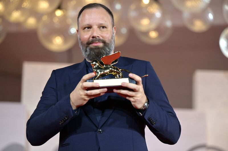 Yorgos Lanthimos holds the Golden Lion award for his film Poor Things at the closing ceremony. EPA