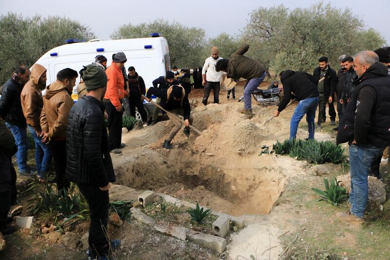 Friends and relatives of Ghada Ismael bury her body. The 25-year-old woman died from Covid-19.
