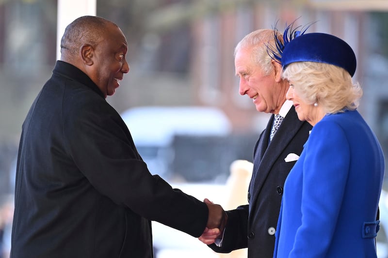 Cyril Ramaphosa shakes hands with King Charles and Queen Consort Camilla. AP