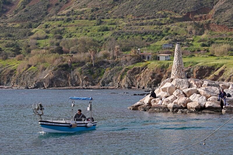 A Cypriot fisherman sails off the coast of the northern village of Pomos. Only 17,000 Russian tourists came to Cyprus between January and June this year.