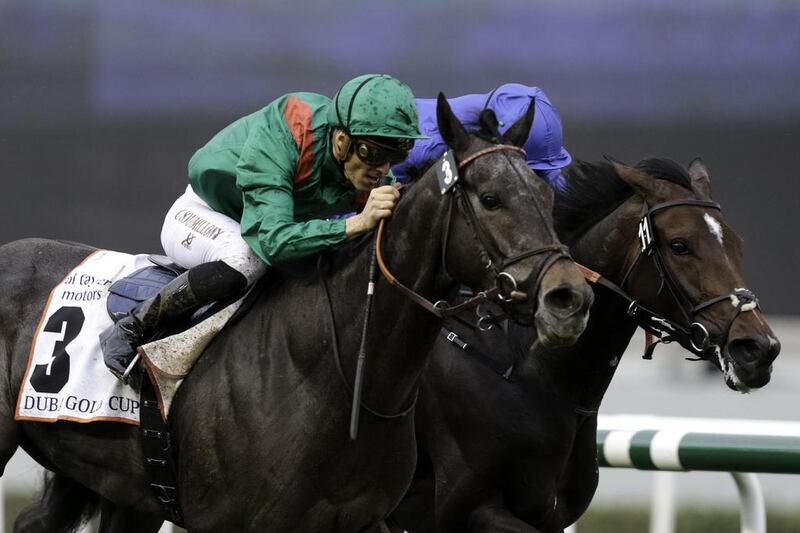 Christophe Soumillion atop Vazirabad races to victory in the Dubai Gold Cup. Christopher Pike / The National