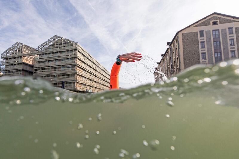 A swimmer attends the open swim stars 10km open waters swimming competition at canal de l'Ourcq, Northeastern Paris.  AFP