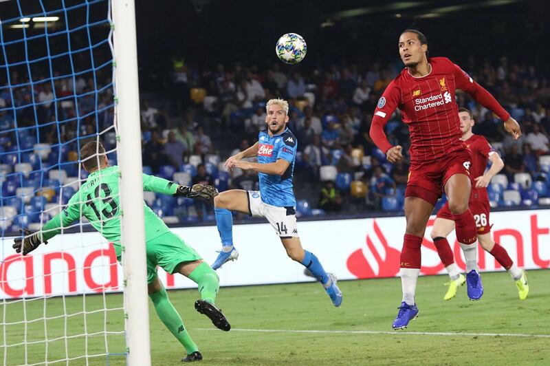 Napoli's Dries Mertens and Liverpool's Virgil van Dijk in action. EPA