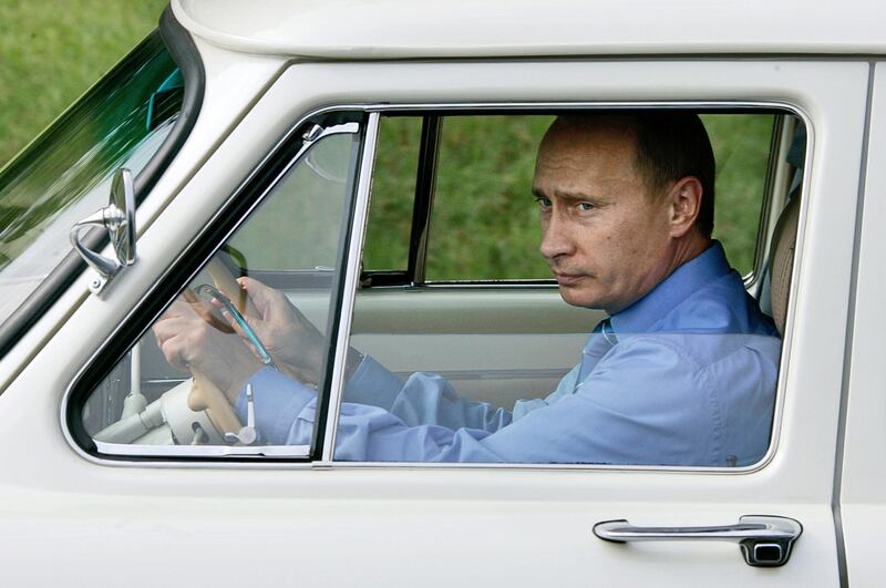 Putin takes a ride in his 1956 "Volga" as he attends an opening ceremony of Adler-Krasnaya Polyana tunnel in Krasnodar region on August 19, 2005. AFP