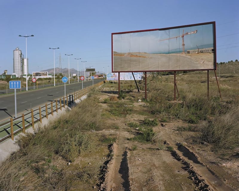 A photo from the Imported Landscape series by Corinne Silva displayed on a billboard in Spain. Courtesy Corinne Silva and The Mosaic Rooms