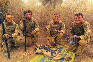 British peacekeepers pose with an AK47 rifle found in an operation against ISIS-linked militants operating in Mali. Ministry of Defence