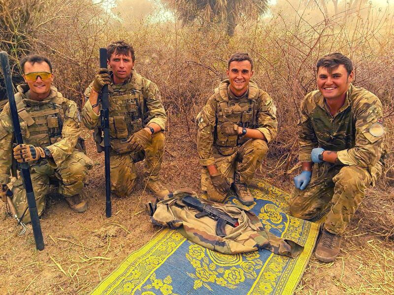 British peacekeepers pose with an AK47 rifle found in an operation against ISIS-linked militants operating in Mali. Ministry of Defence
