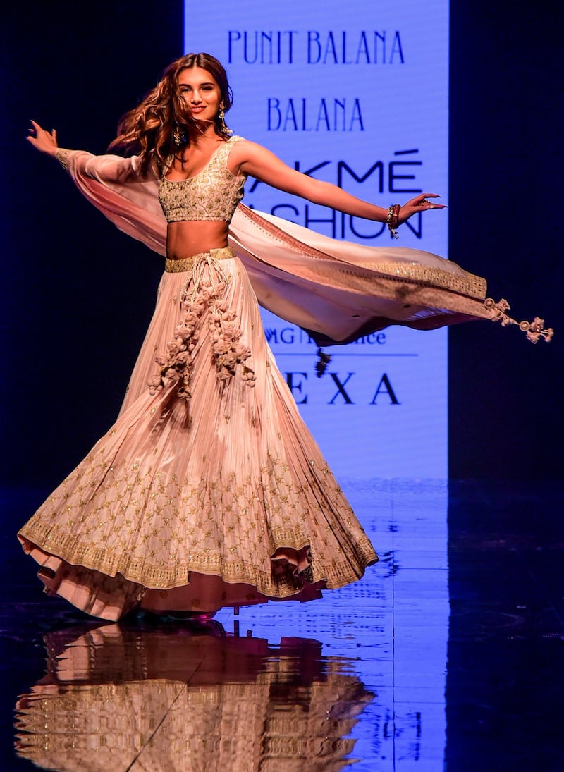 Tara Sutaria presents a creation by Punit Balana during Lakme Fashion Week in Mumbai on February 15, 2020. AFP