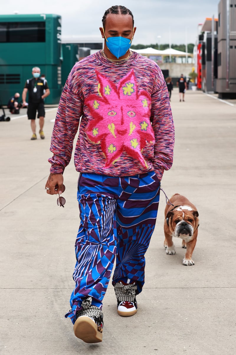 Lewis Hamilton, in clashing prints with a Myfawnwy jumper and blue trousers, ahead of the British Grand Prix at Silverstone on July 15, 2021. Getty Images