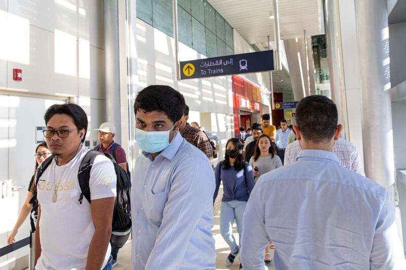 A commuter, wearing protective face mask, walks through a metro station in downtown Dubai on March 5. Bloomberg