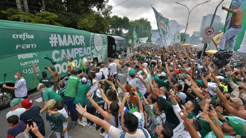 Palmeiras supporters surround a bus taking its players from the club's training centre to the airport. AFP