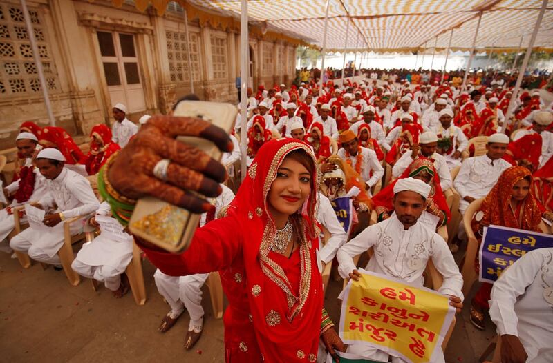 A bride takes a selfie after taking part in a mass wedding in Ahmedabad, India. 111 Muslim couples took their wedding vows. Amit Dave / Reuters