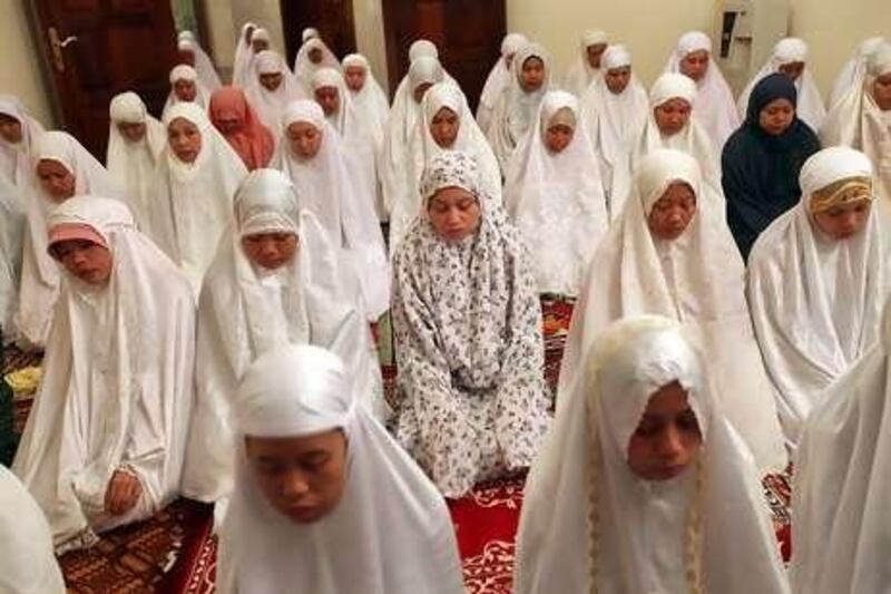Indonesian women gather at the embassy in Abu Dhabi for taraweeh prayers. The gatherings during Ramadan help to strengthen ties in the community.