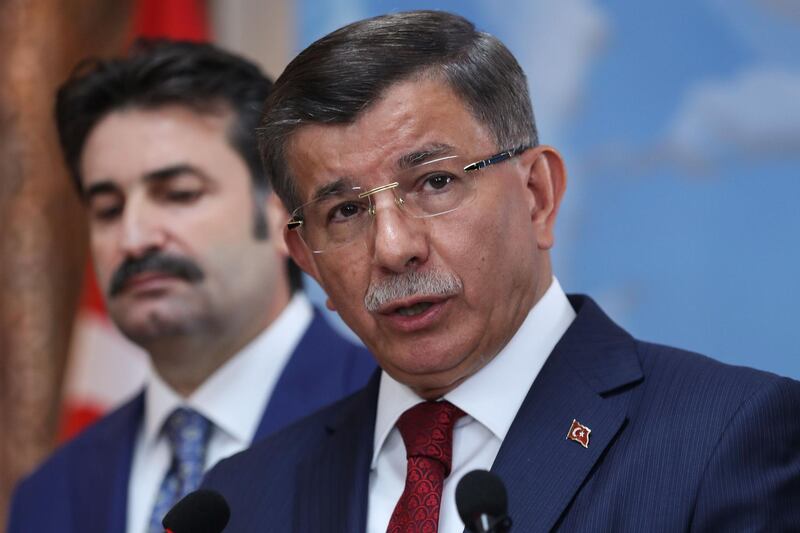Former Turkish Prime Minister Ahmet Davutoglu (R) holds a press conference at his office in Ankara on September 13, 2019, to announce that he would launch a "new political movement" in the latest challenge to President Recep Tayyip Erdogan from his former allies.  / AFP / Adem ALTAN
