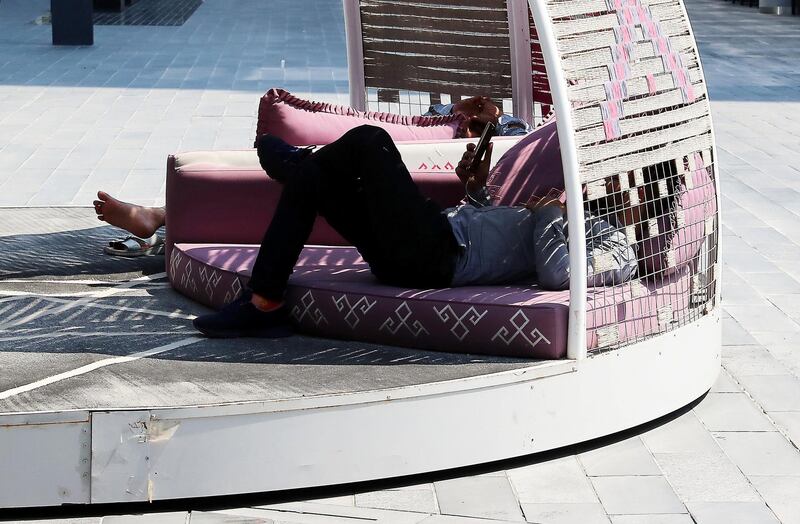DUBAI ,  UNITED ARAB EMIRATES , JUNE 10 – 2019 :- People relaxing during the hot day at the Dubai Design District area in Dubai.  ( Pawan Singh / The National ) For News/Online/Instagram/Big Picture/Standalone