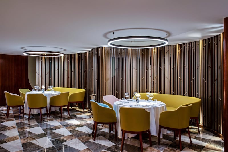 The space features features sleek interiors with marble flooring and wood-panelled walls. Courtesy Queens Grill