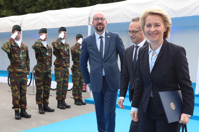 Belgium's Prime Minister Charles Michel (L) greets German Minister of Defence Ursula von der Leyen (R) as she arrives for a working dinner at The Parc du Cinquantenaire - Jubelpark Park in Brussels on July 11, 2018, during the North Atlantic Treaty Organization (NATO) summit.  / AFP / POOL / BENOIT DOPPAGNE
