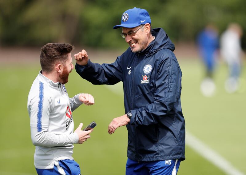 Chelsea manager Maurizio Sarri shares a joke during training. Reuters