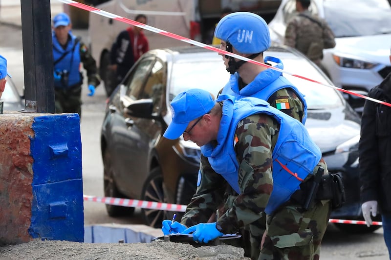 Irish UN peacekeepers investigate the scene of the attack. AP