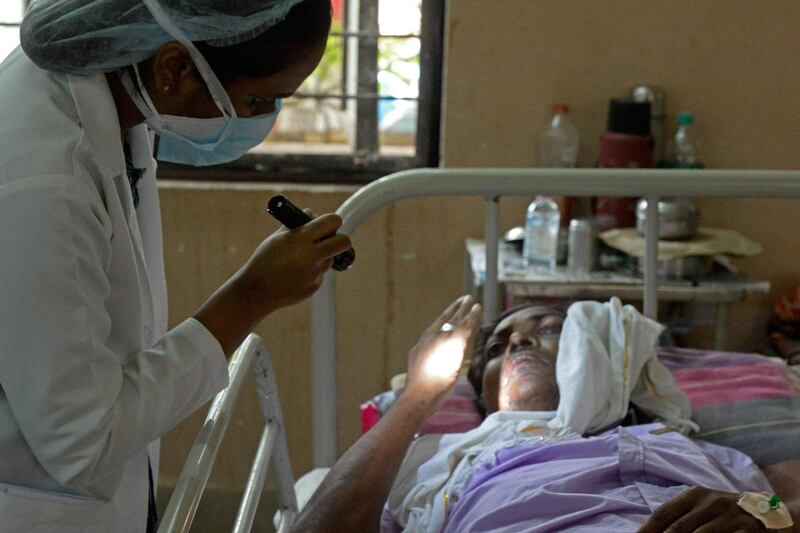 A doctor examines a patient who recovered from Covid-19 and now infected with Black Fungus, a deadly fungal infection, at a ward of a government hospital in Hyderabad. AFP