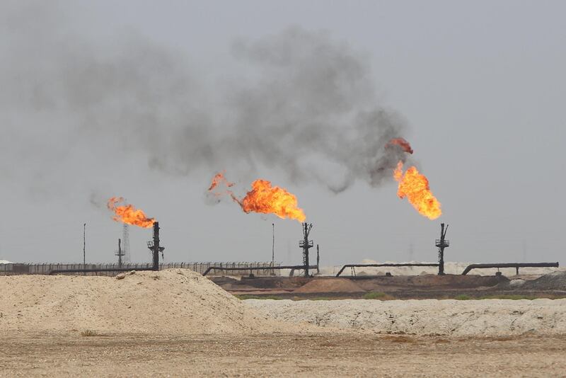 Flames emerge from the flare stacks at the West Qurna-1 oilfield, which is operated by Exxon Mobil, near Basra, Iraq.  Reuters