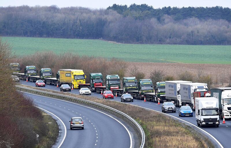FILE PHOTO: A line of lorries is seen during a trial between disused Manston Airport and the Port of Dover of how road will cope in case of a "no-deal" Brexit, Kent, Britain January 7, 2019. REUTERS/Toby Melville/File Photo