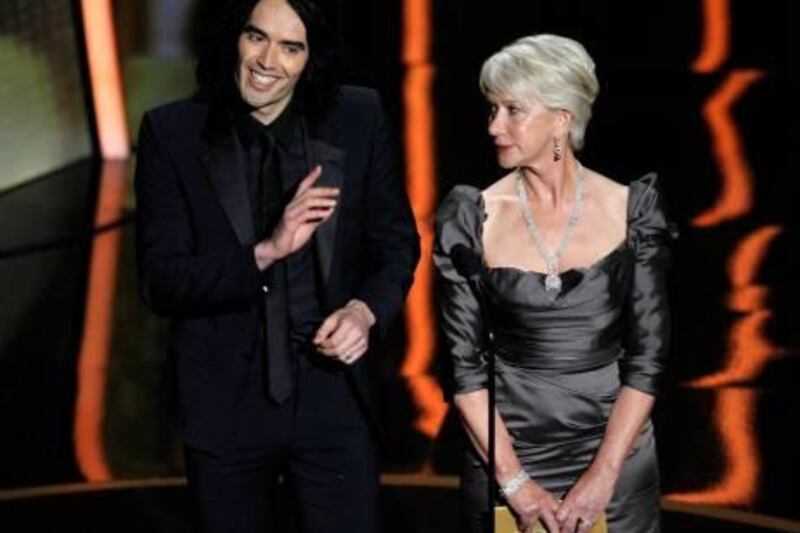 Presenters Russell Brand (L) and Helen Mirren present during the 83rd Academy Awards in Hollywood, California, February 27, 2011.  REUTERS/Gary Hershorn (UNITED STATES  - Tags: ENTERTAINMENT) (OSCARS-SHOW) *** Local Caption ***  OSC1841_OSCARS-_0228_11.JPG