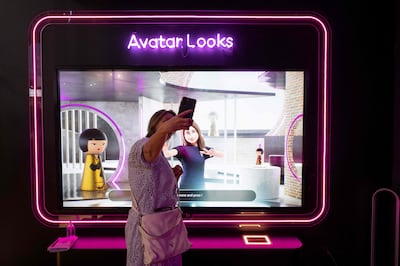 A visitor with her avatar at the Loreal group booth during the Vivatech technology start-ups and innovation fair in Paris in June. AFP