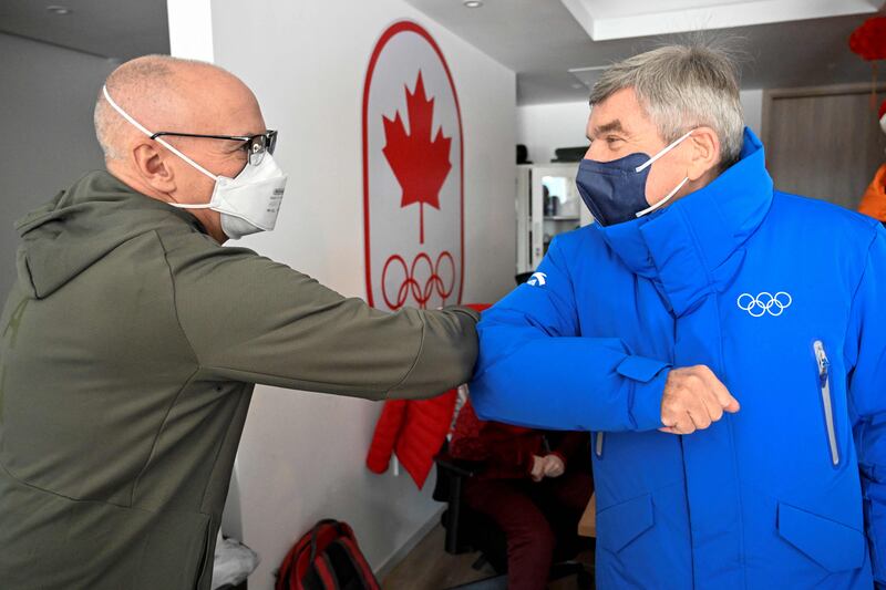 IOC president Thomas Bach visits a room of the Canada team at Beijing 2022 Winter Olympic Games village. AFP