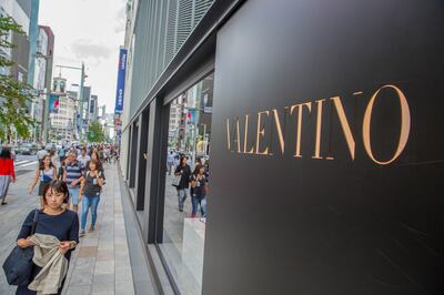 GINZA, TOKYO, JAPAN - 2019/09/26: Tourists walk past Valentino store in Ginza. (Photo by Stanislav Kogiku/SOPA Images/LightRocket via Getty Images)