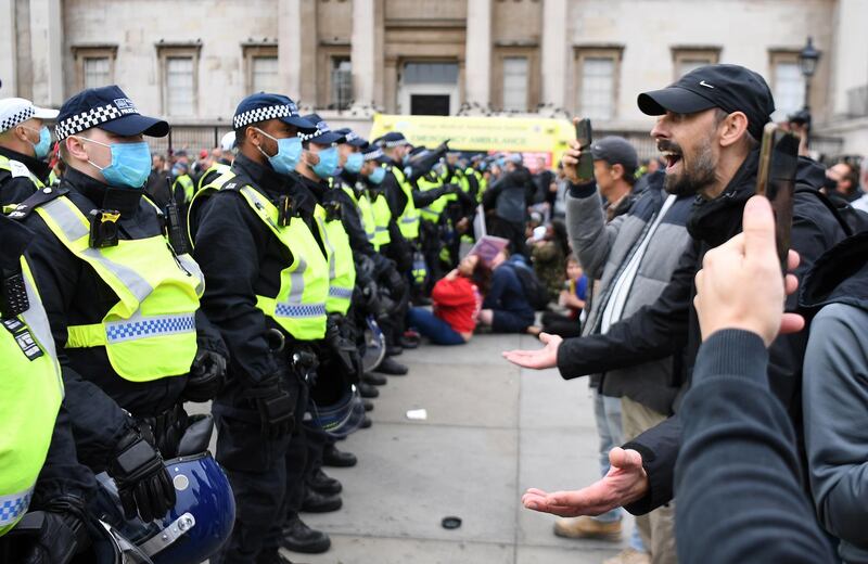 Police clash with protesters during a 'We Do Not Consent' rally at Trafalgar Square in London.  EPA