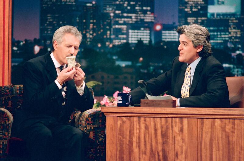 THE TONIGHT SHOW WITH JAY LENO -- Episode 571 -- Pictured: (l-r) "Jeopardy" host Alex Trebek with host Jay Leno during an interviewon November 14, 1994 -- (Photo by: Margaret Norton/NBCU Photo Bank/NBCUniversal via Getty Images via Getty Images)