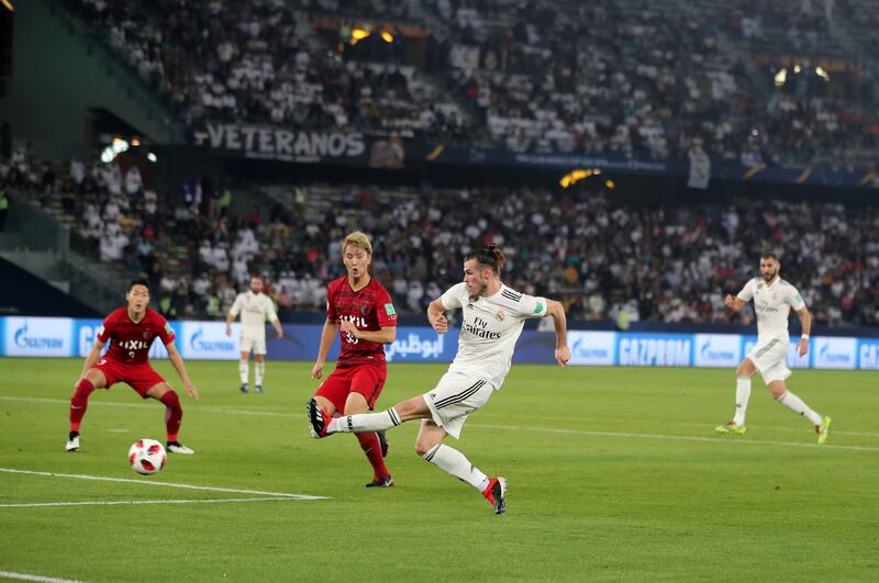 Abu Dhabi, United Arab Emirates - December 19, 2018: Gareth Bale of Real Madrid scores during the game between Real Madrid and Kashima Antlers in the Fifa Club World Cup semi final. Wednesday the 19th of December 2018 at the Zayed Sports City Stadium, Abu Dhabi. Chris Whiteoak / The National