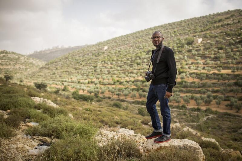 American writer and photographer Teju Cole in Ramallah, West Bank, 2014. His images are of the physical world seen at a tilt. Rob Stothard / Getty Images 