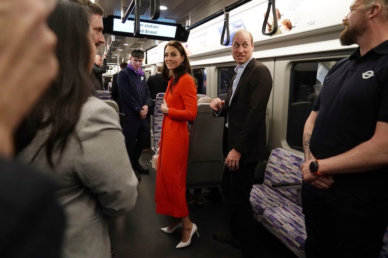 The royal couple on an Elizabeth Line carriage. AP